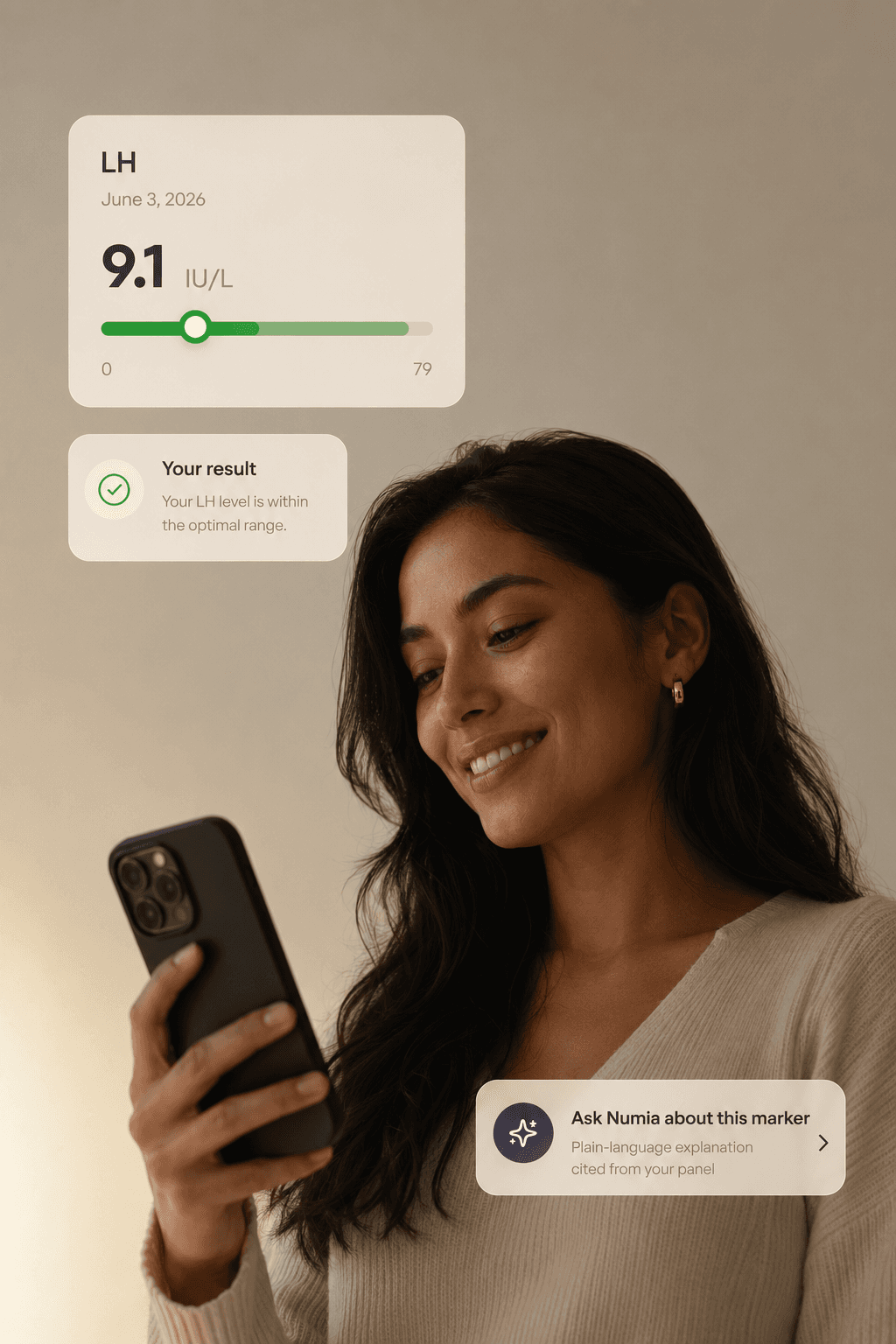 A woman checking her LH result in the Numia app on her phone